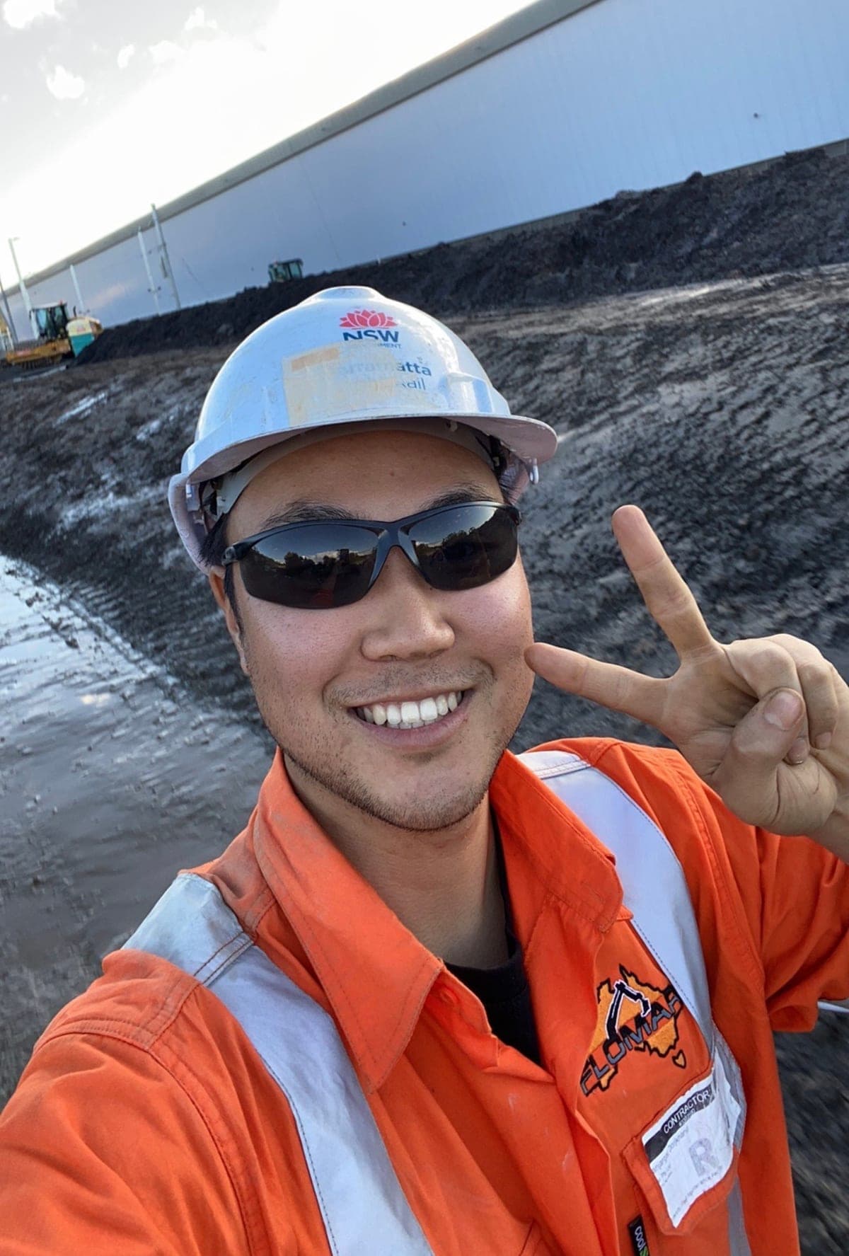 Obi Batbileg in hi-vis and a hard hat on a Sydney construction site in 2020.